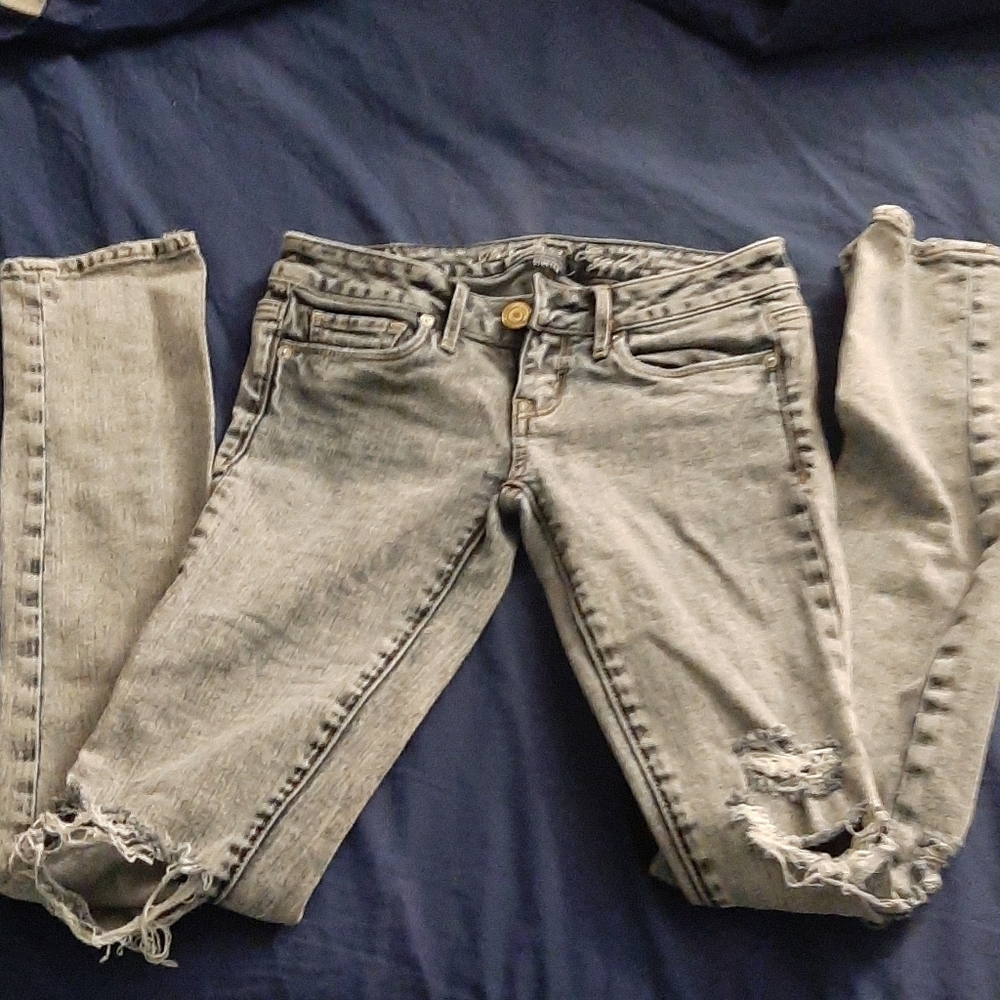 Light blue-gray ripped jeans